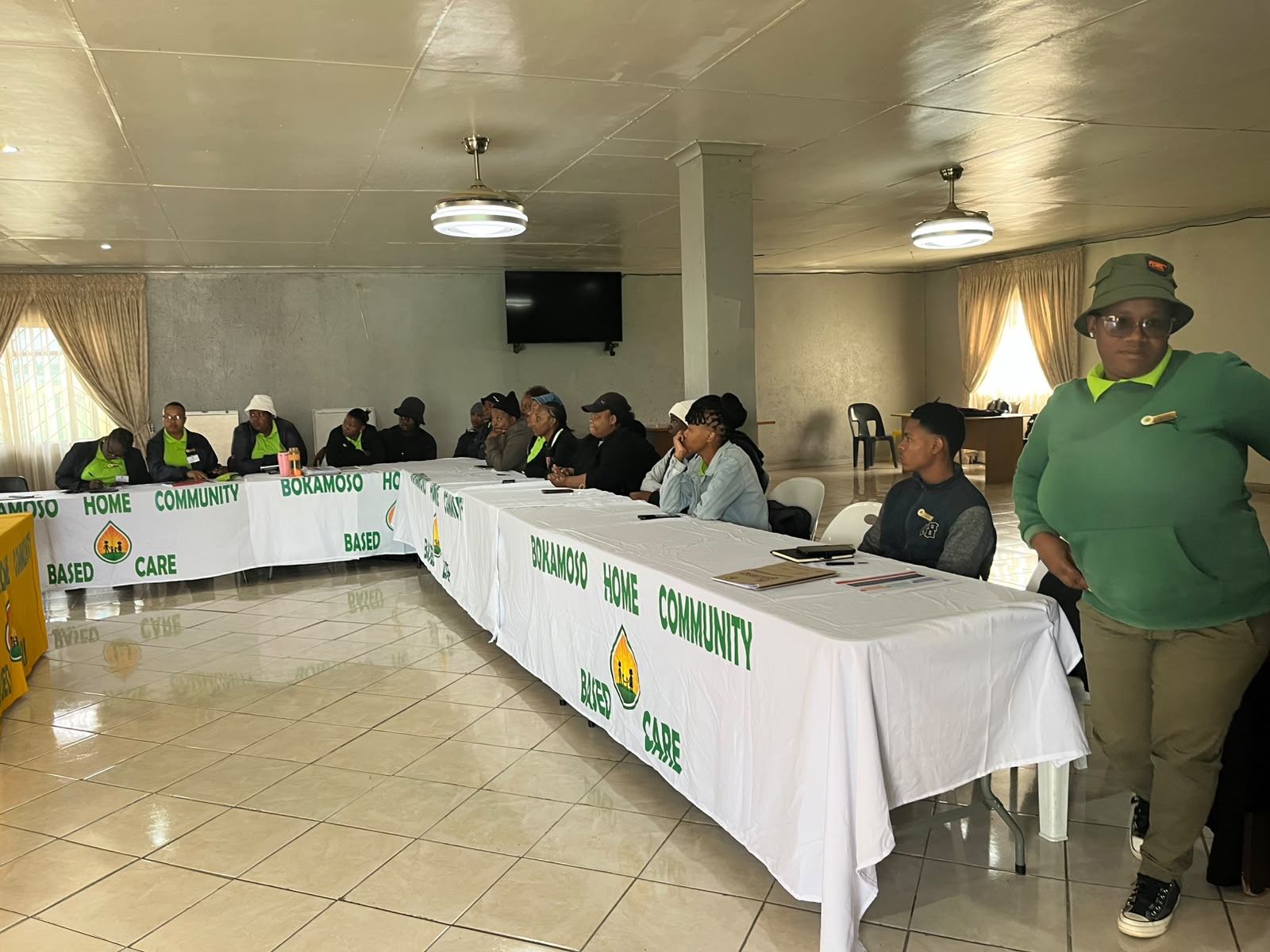 Bokamoso team members seated around tables during a meeting